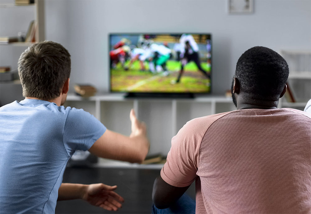 guys watching sports on TV